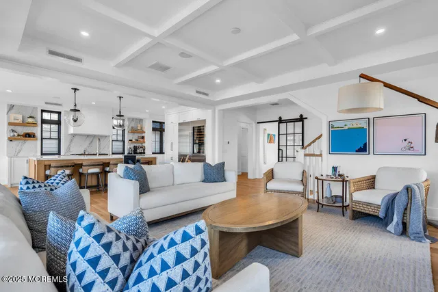 a living room with furniture and a table