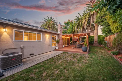 a view of a backyard with a sitting area