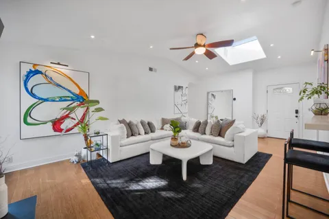 a living room with furniture and a rug