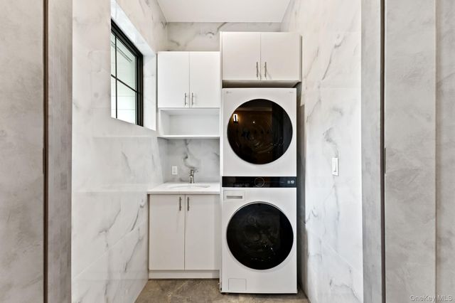 a view of a hallway with washer and dryer