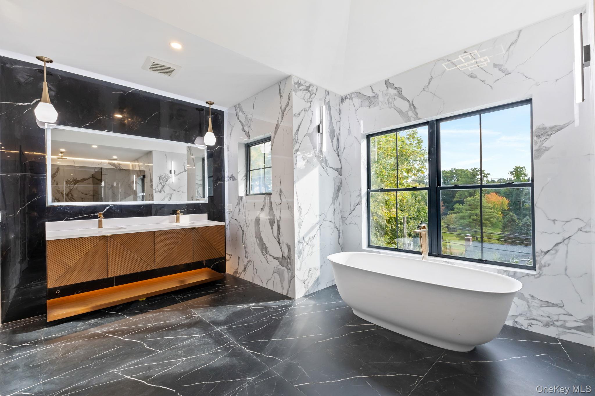 22 Whippoorwill Road East Armonk, NY 10504 - Photo 21 of 47 a living room with a large window and furniture