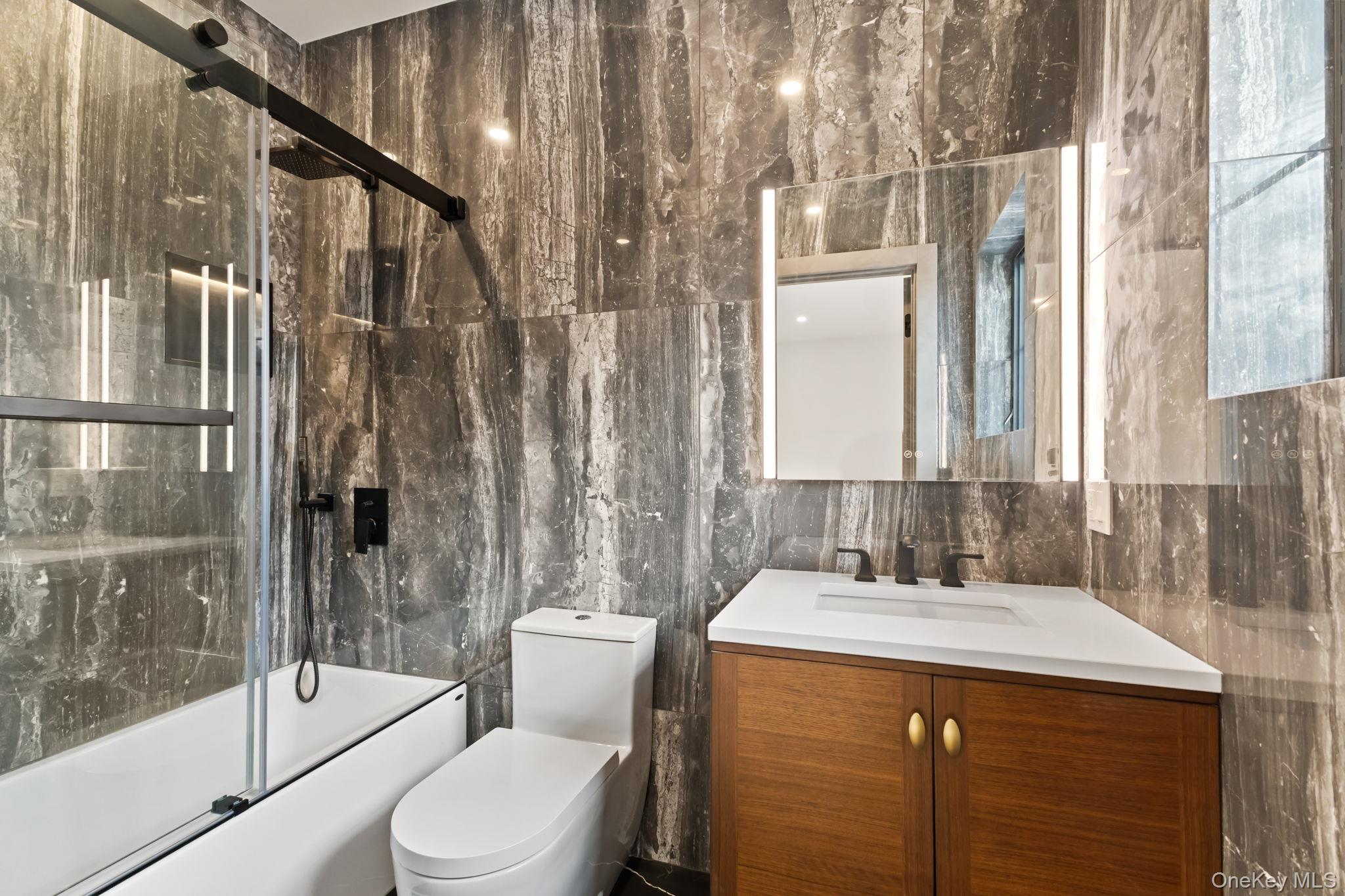 22 Whippoorwill Road East Armonk, NY 10504 - Photo 27 of 47 a bathroom with a sink toilet and shower