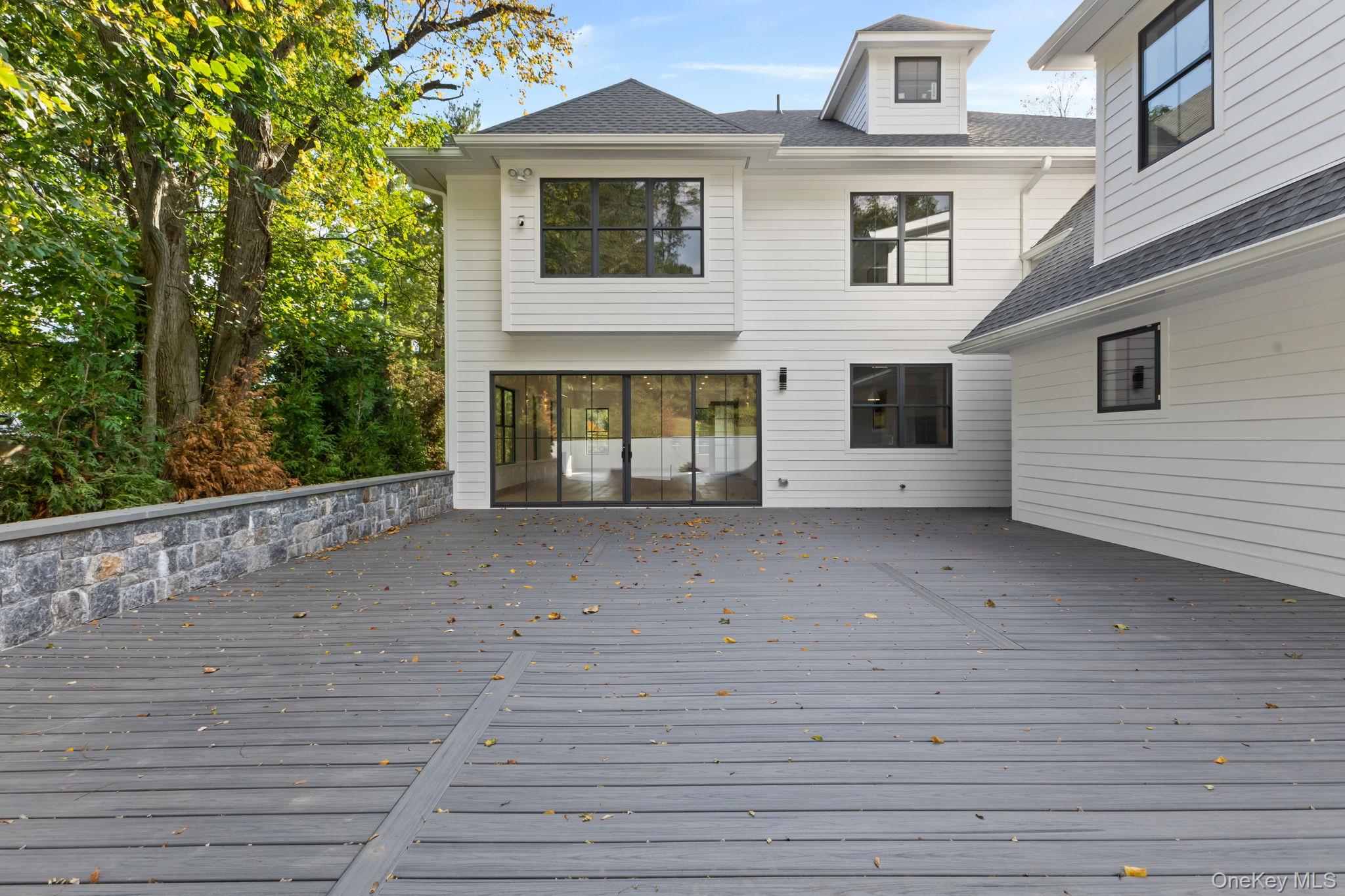 22 Whippoorwill Road East Armonk, NY 10504 - Photo 28 of 47 a view of a house with a balcony