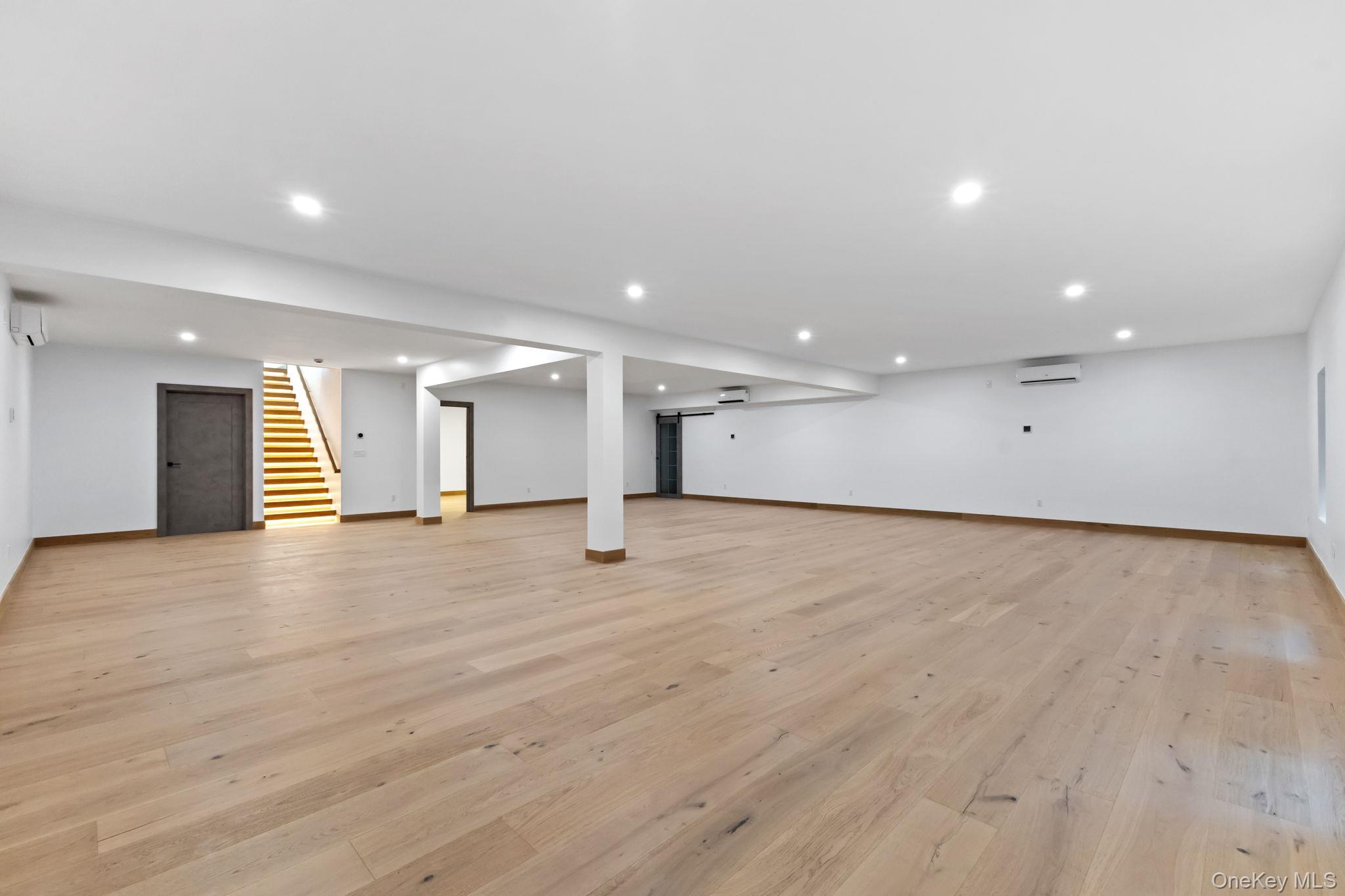 22 Whippoorwill Road East Armonk, NY 10504 - Photo 31 of 50 a view of an empty room with wooden floor