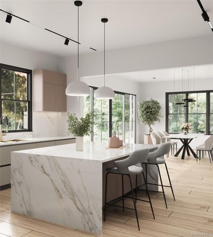 a dining hall with stainless steel appliances kitchen island granite countertop a sink a dining table and chairs with wooden floor