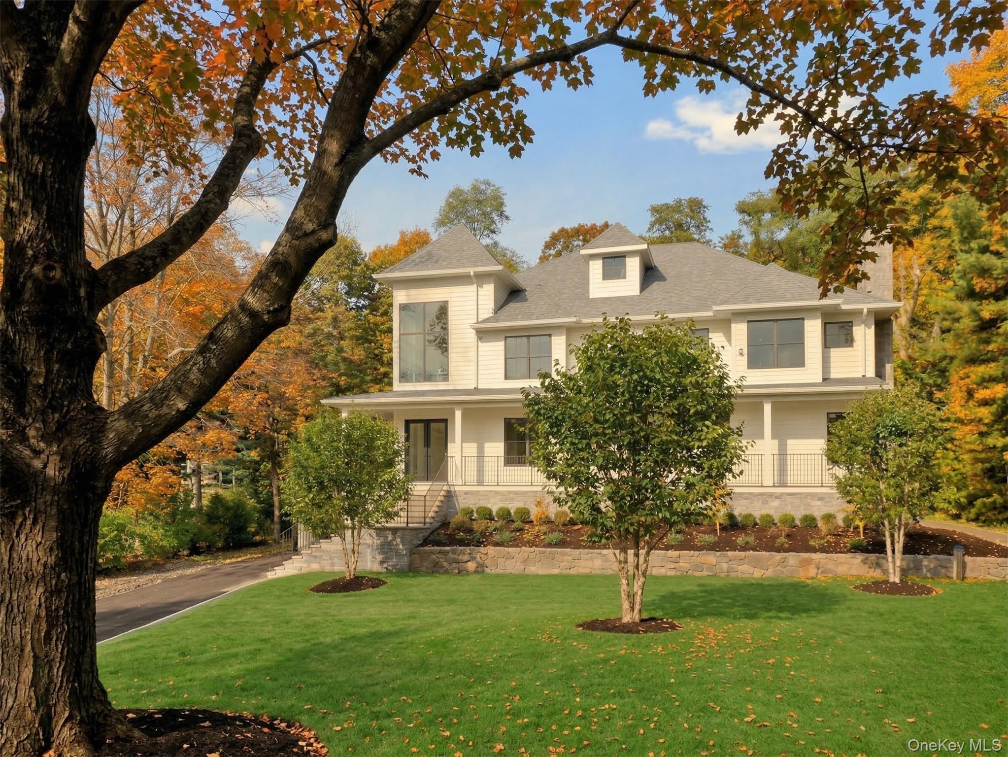 22 Whippoorwill Road East Armonk, NY 10504 - Photo 44 of 50 a front view of a house with a yard