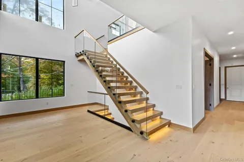 a view of entryway with stairs and wooden floor