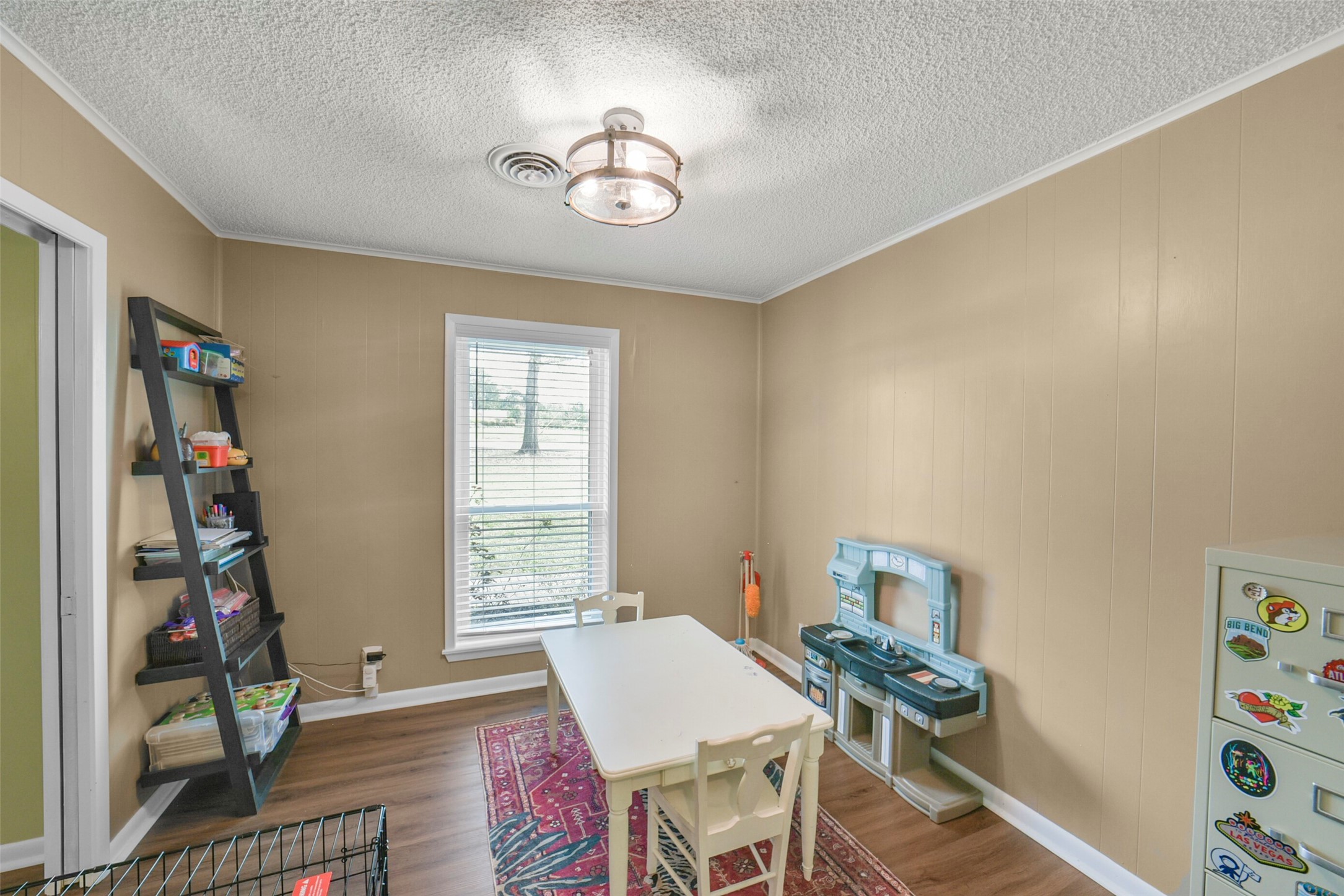 10313 South Williams Road Conroe, TX 77303 - Photo 20 of 48 The dining room is currently being utilized as a play room.