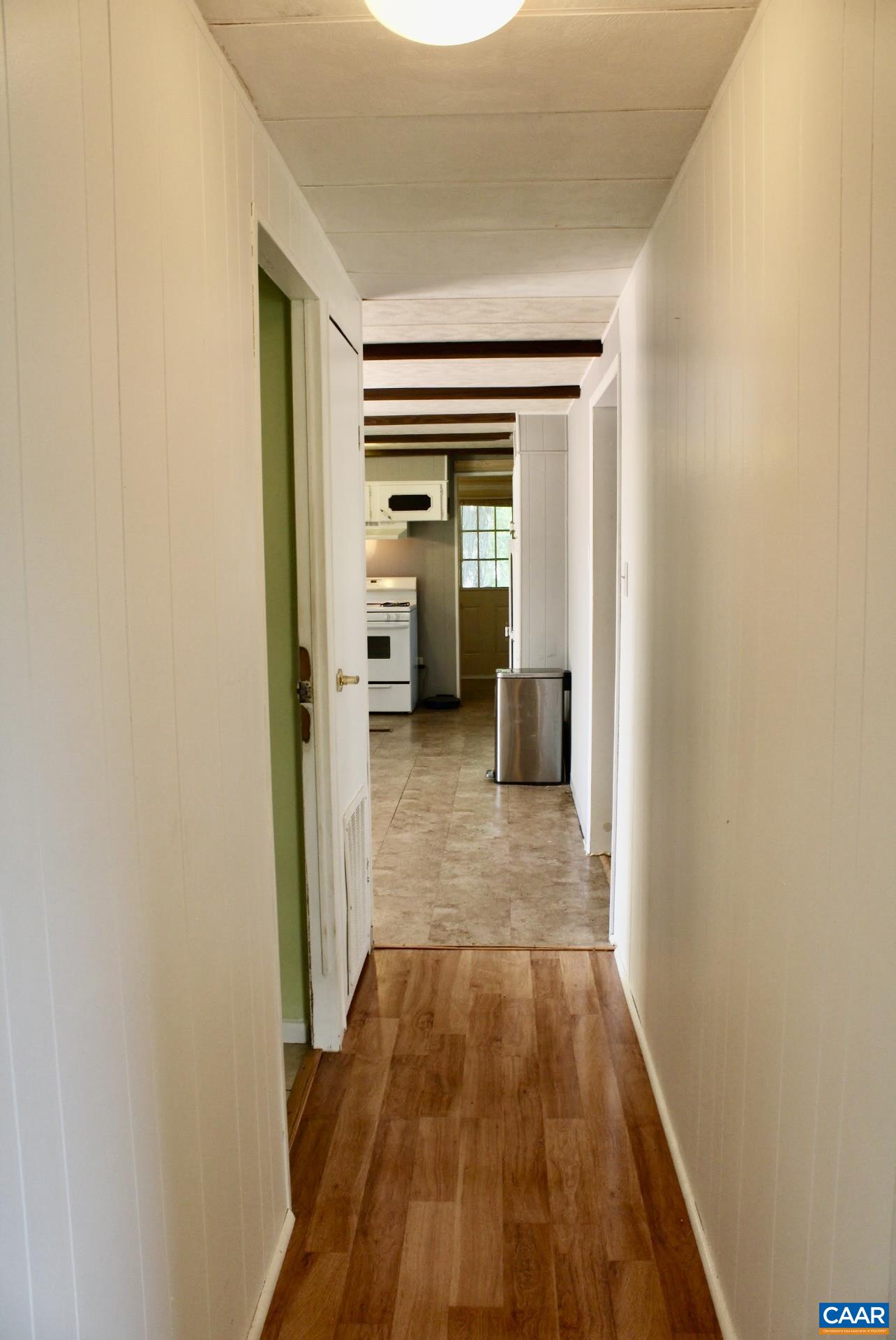 6790 Foster Ridge Charlottesville, VA 22903 - Photo 12 of 43 a view of a hallway with wooden floor and furniture