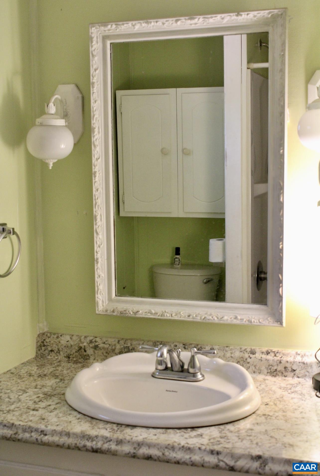 6790 Foster Ridge Charlottesville, VA 22903 - Photo 15 of 43 a bathroom with a sink and a mirror
