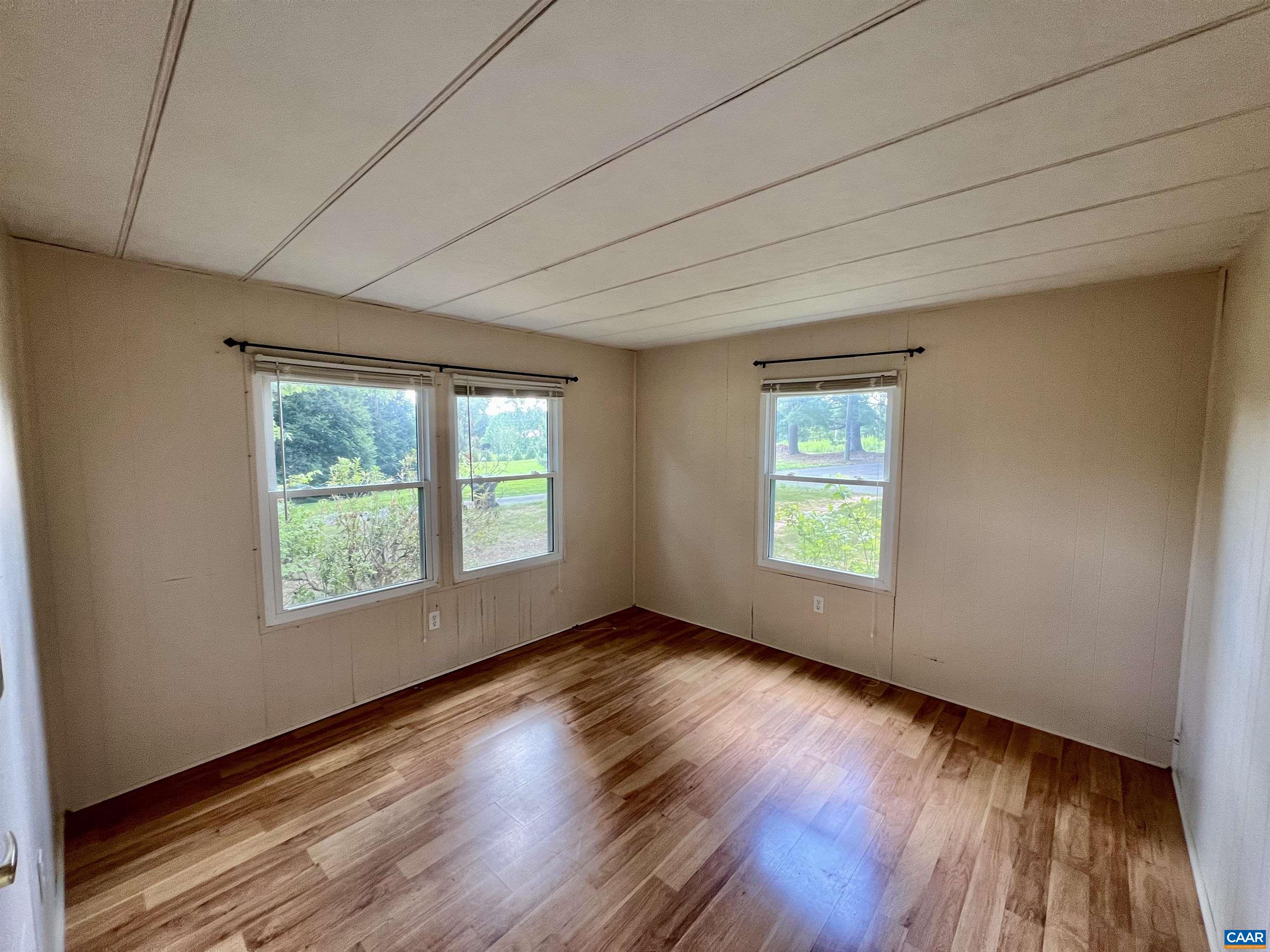 6790 Foster Ridge Charlottesville, VA 22903 - Photo 18 of 43 a view of an empty room with wooden floor and a window