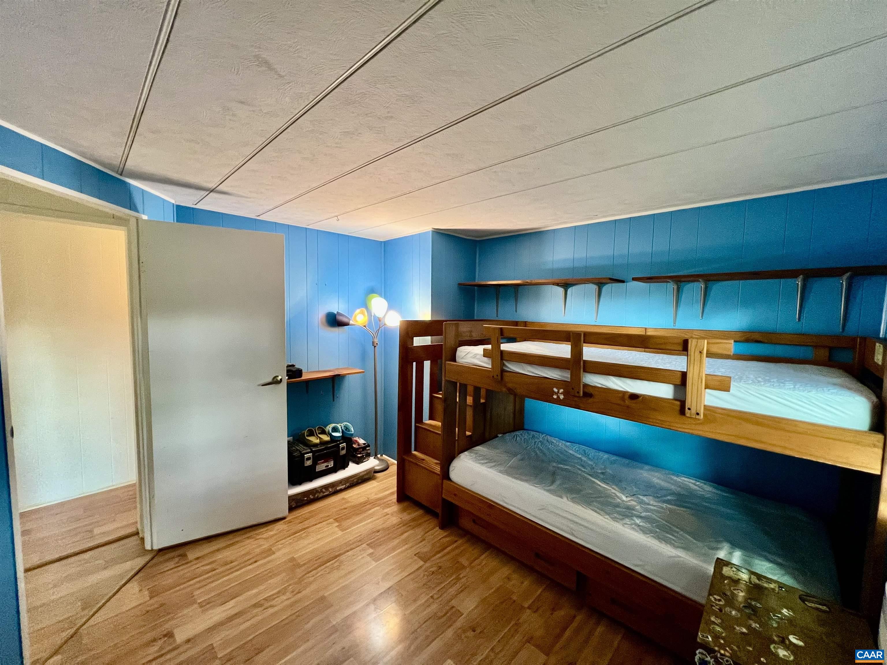 6790 Foster Ridge Charlottesville, VA 22903 - Photo 19 of 43 a bedroom with furniture and a fireplace