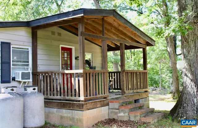 a view of a chair and table in the patio