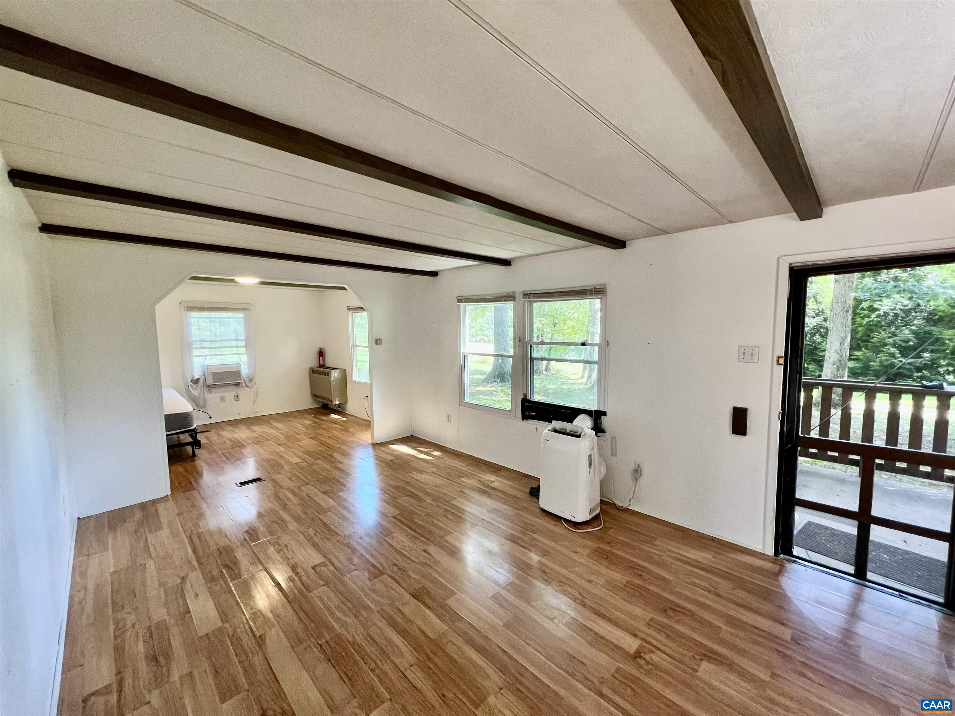 6790 Foster Ridge Charlottesville, VA 22903 - Photo 3 of 43 a view of empty room with wooden floor and fan