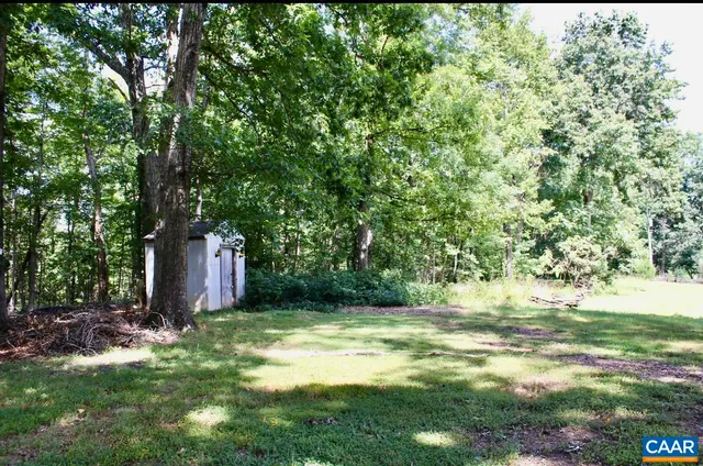 a backyard of a house with lots of green space