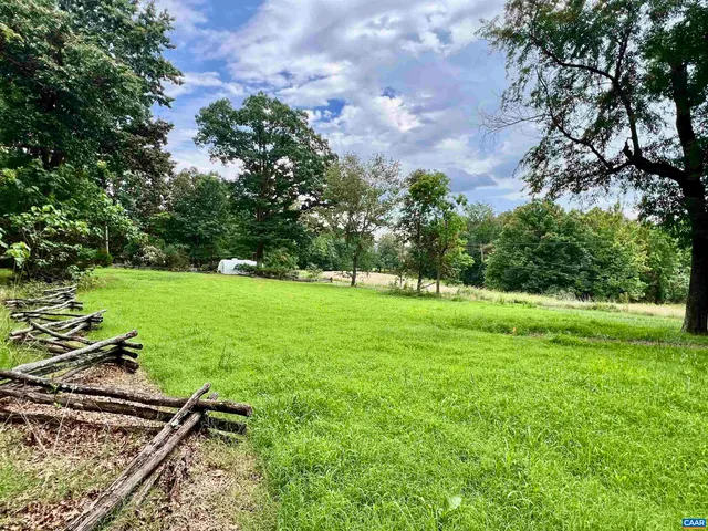 a backyard of a house with lots of green space