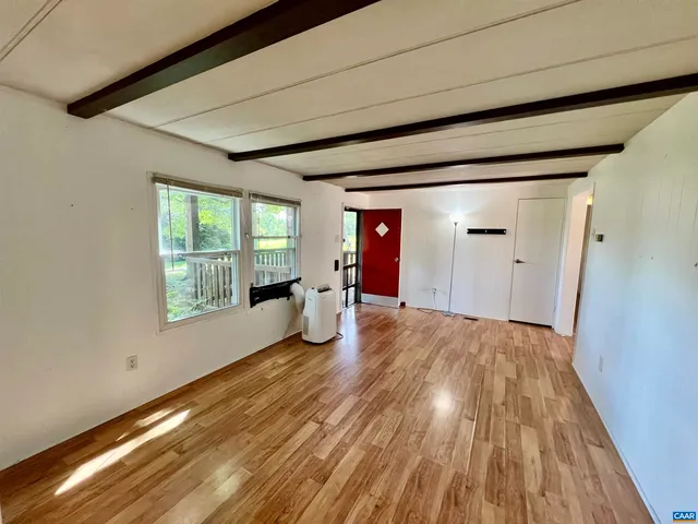 a view of an empty room and window