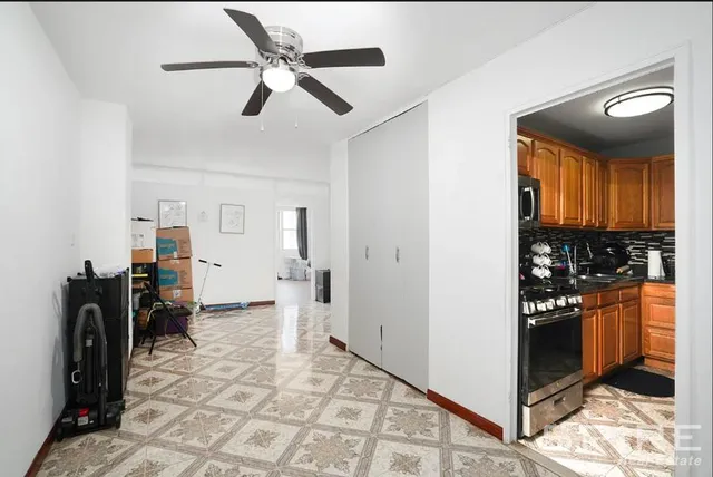 a kitchen with stainless steel appliances granite countertop a stove and a microwave