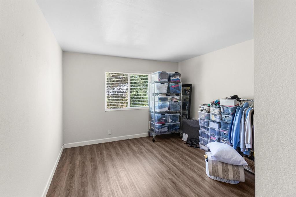 3340 Skytrail Ranch Road Jamul, CA 91935 - Photo 26 of 38 a room with furniture and a wooden floor