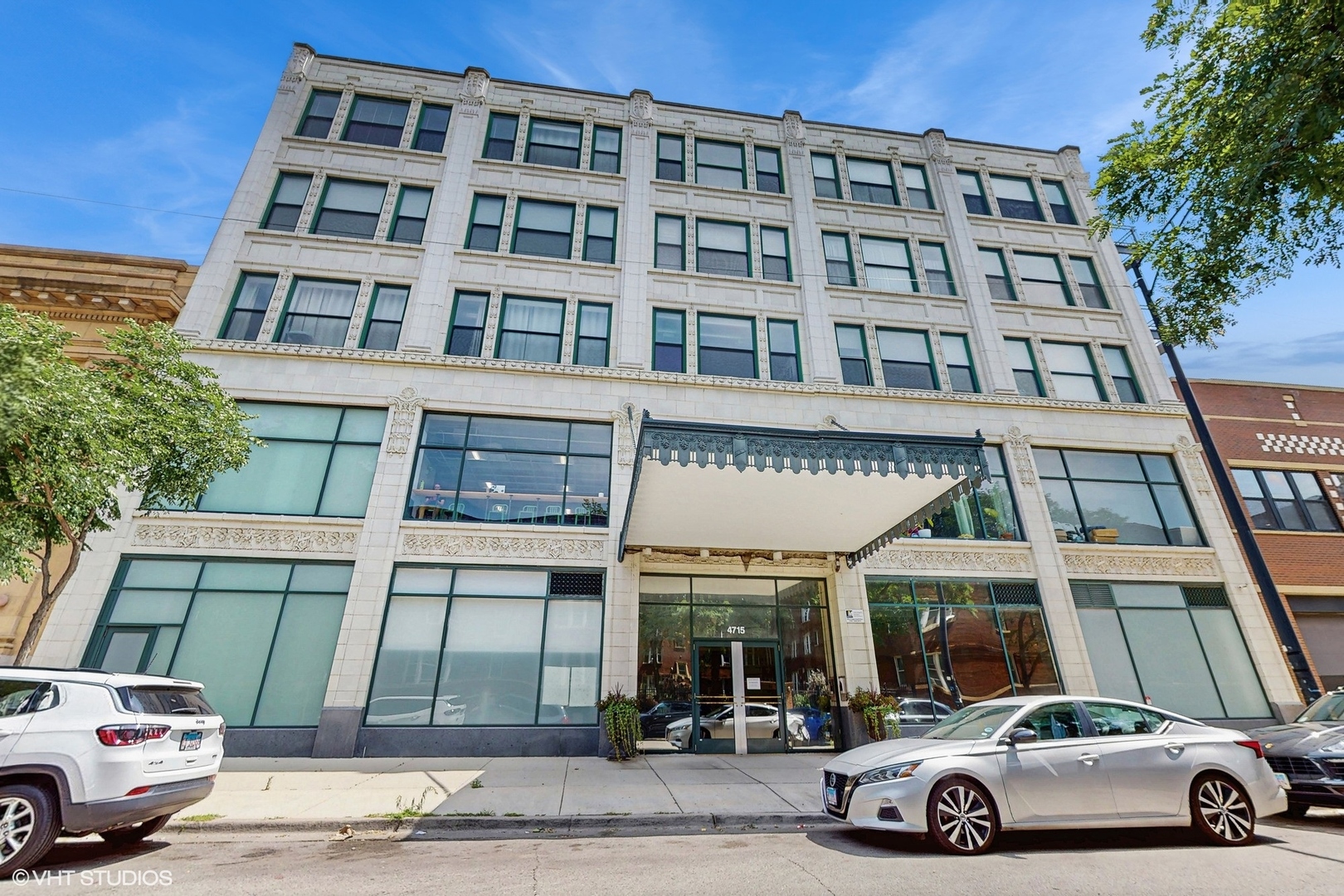4715 North Racine Avenue, Unit 305 Chicago, IL 60640 - Photo 1 of 24 a car parked in front of a building