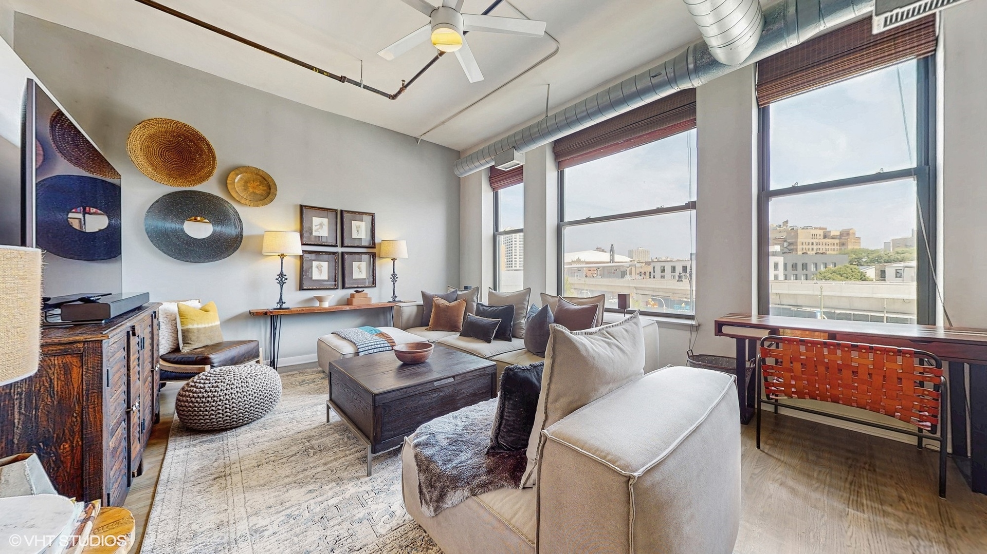 4715 North Racine Avenue, Unit 305 Chicago, IL 60640 - Photo 3 of 24 a living room filled with furniture and a large window