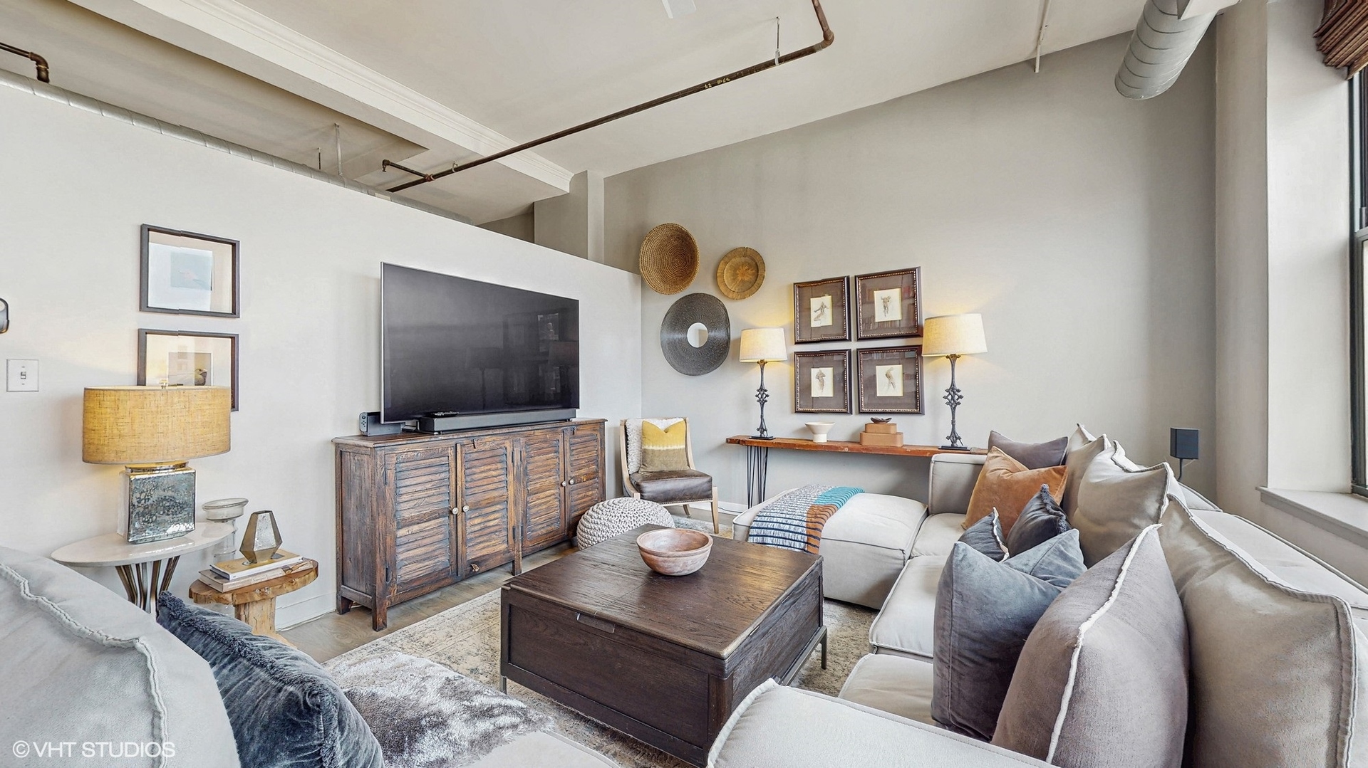 4715 North Racine Avenue, Unit 305 Chicago, IL 60640 - Photo 4 of 24 a living room with furniture and a flat screen tv