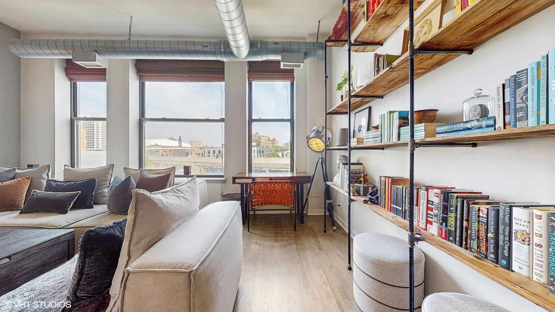 4715 North Racine Avenue, Unit 305 Chicago, IL 60640 - Photo 6 of 24 a living room with furniture a rug and a window