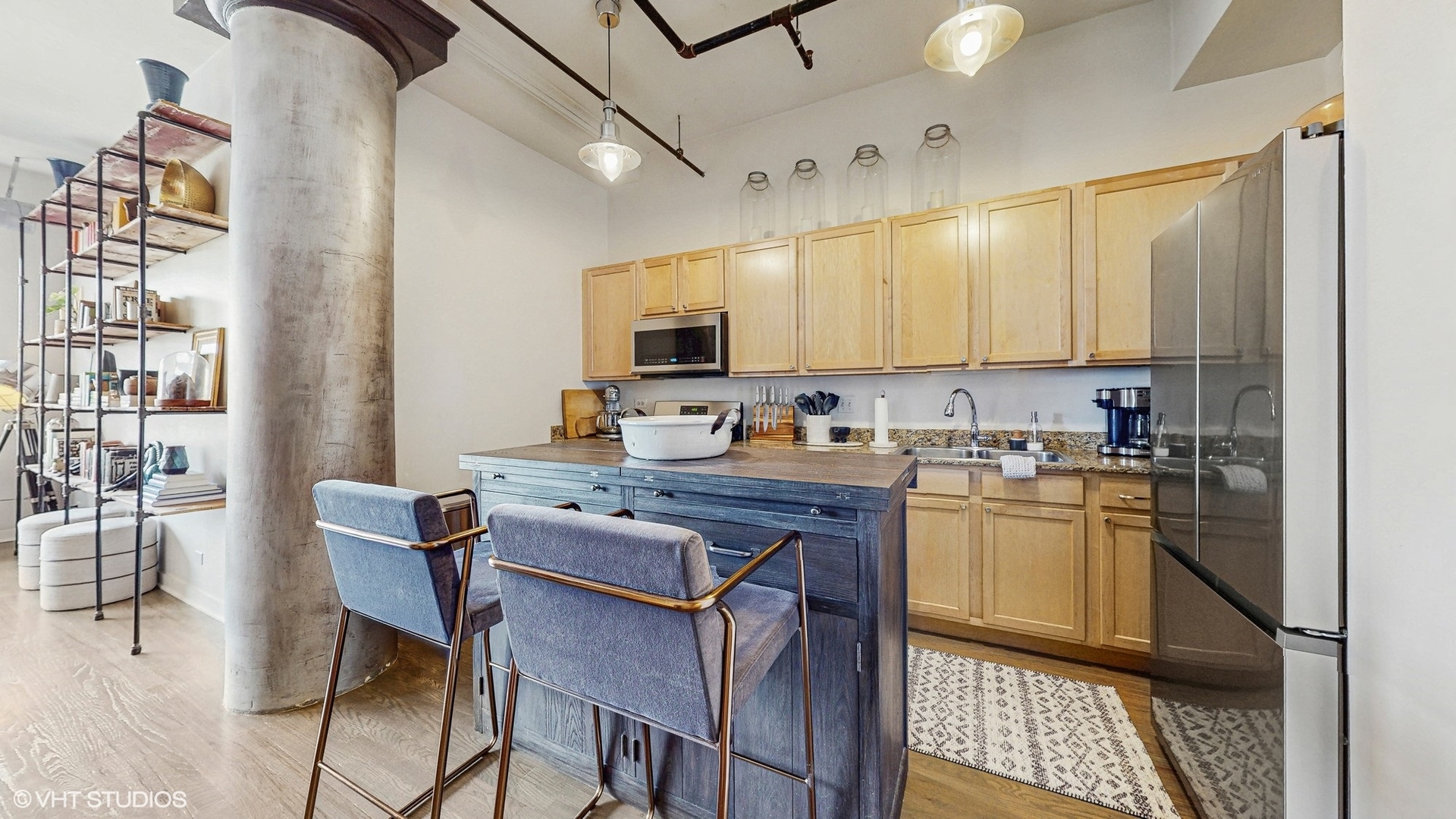 4715 North Racine Avenue, Unit 305 Chicago, IL 60640 - Photo 7 of 24 a kitchen with stainless steel appliances granite countertop a stove top oven a sink dishwasher and cabinets with wooden floor