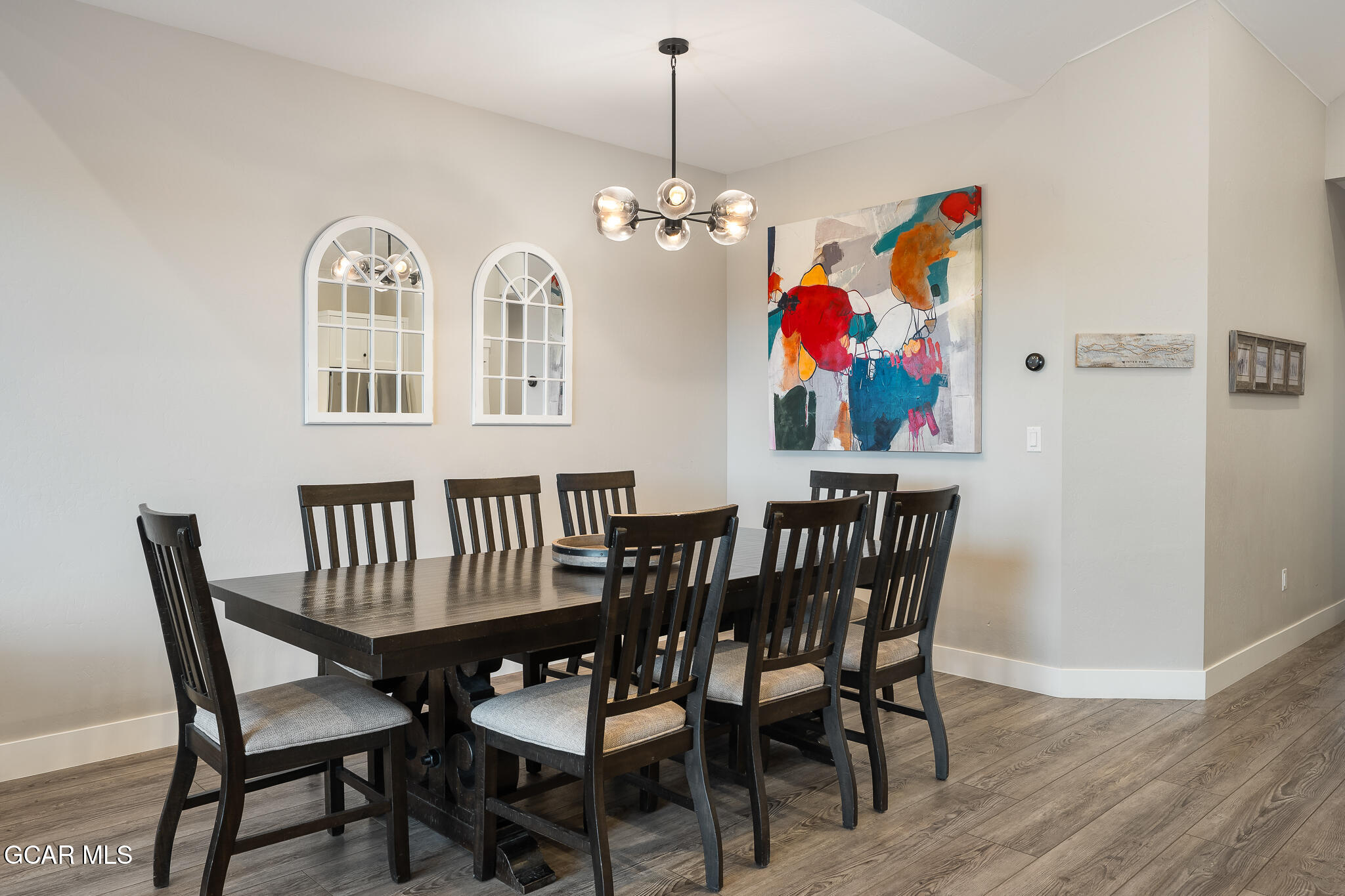 74 Eagle Ridge Drive Granby, CO 80446 - Photo 11 of 44 a view of a dining room with furniture wooden floor and chandelier