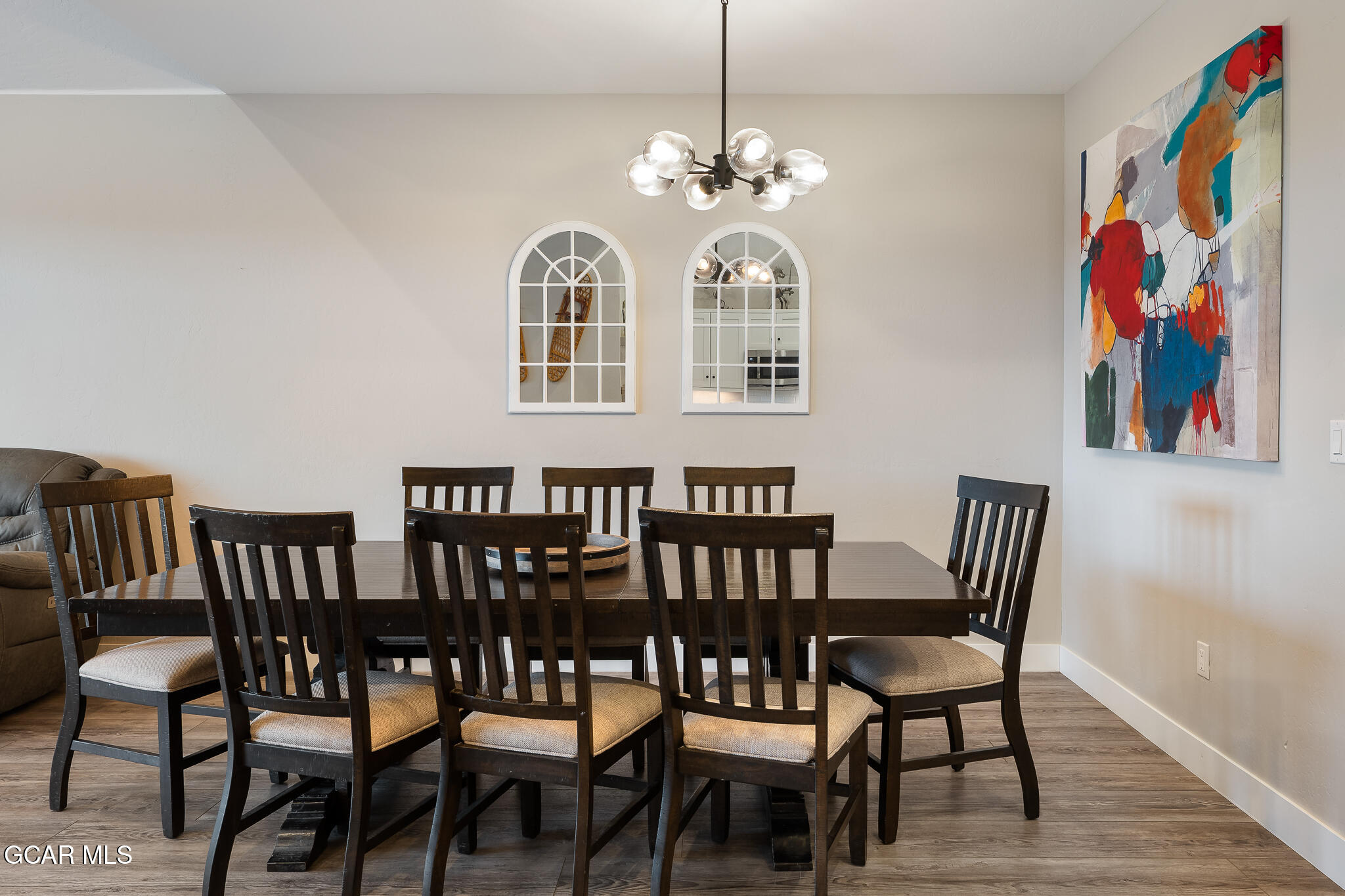 74 Eagle Ridge Drive Granby, CO 80446 - Photo 12 of 44 a view of a dining room with furniture and chandelier