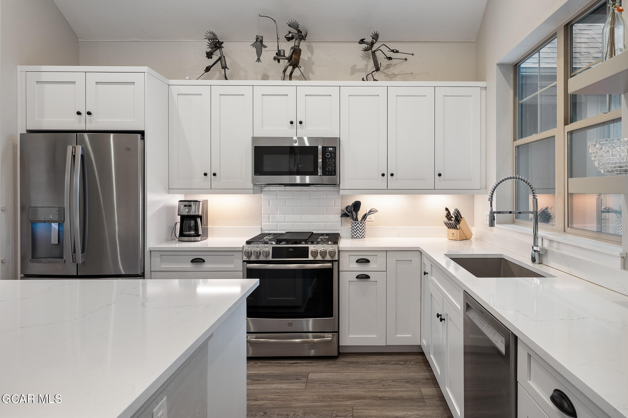 74 Eagle Ridge Drive Granby, CO 80446 - Photo 14 of 44 a kitchen with cabinets stainless steel appliances and a sink