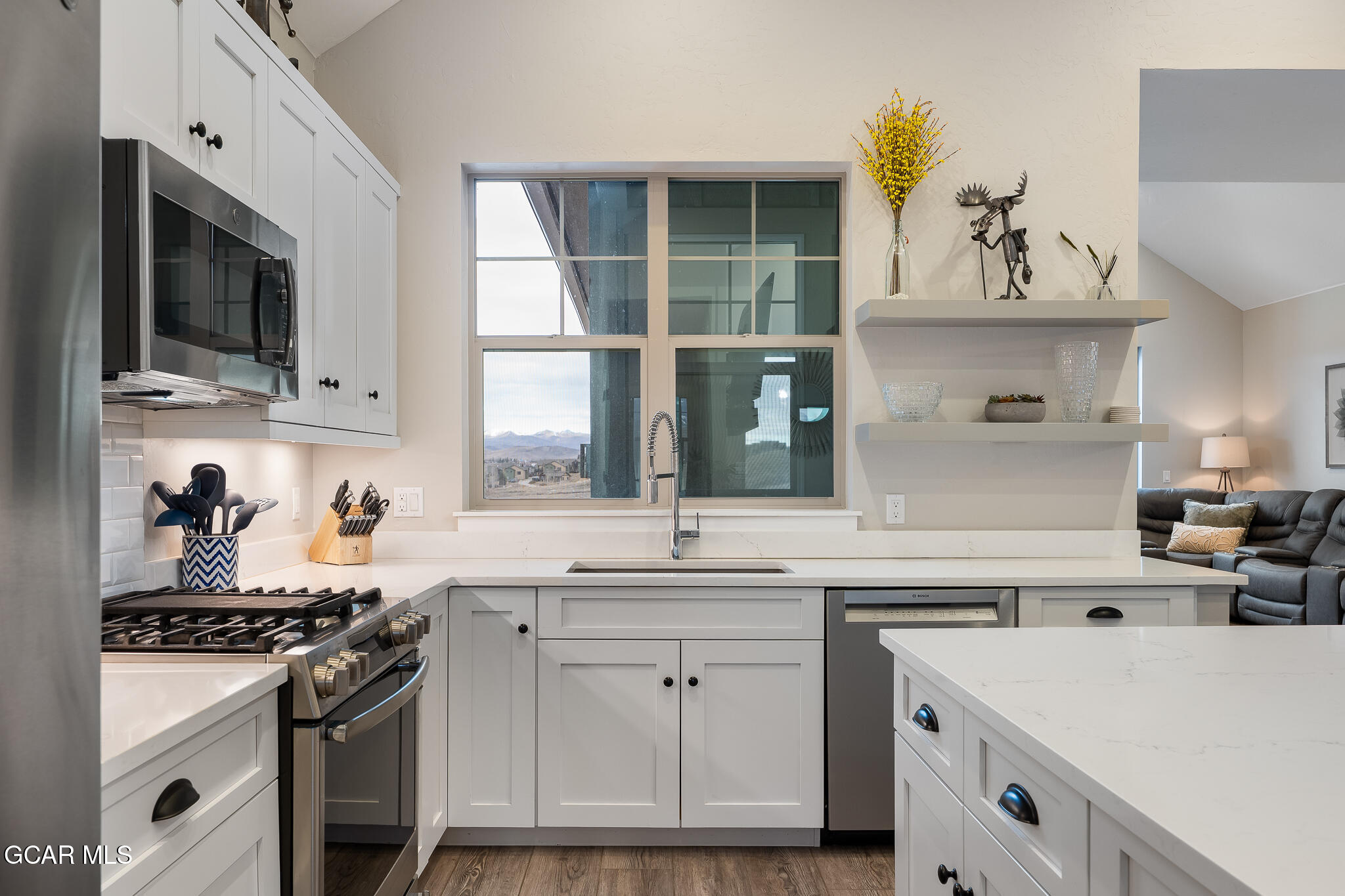 74 Eagle Ridge Drive Granby, CO 80446 - Photo 17 of 44 a kitchen with a sink stove and microwave
