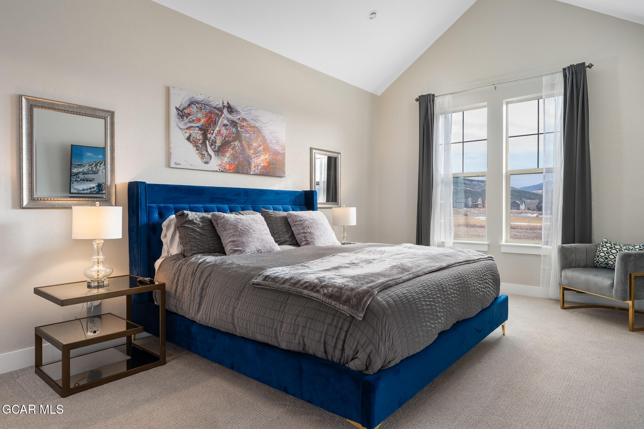 74 Eagle Ridge Drive Granby, CO 80446 - Photo 19 of 44 a bedroom with a bed a couch and a window