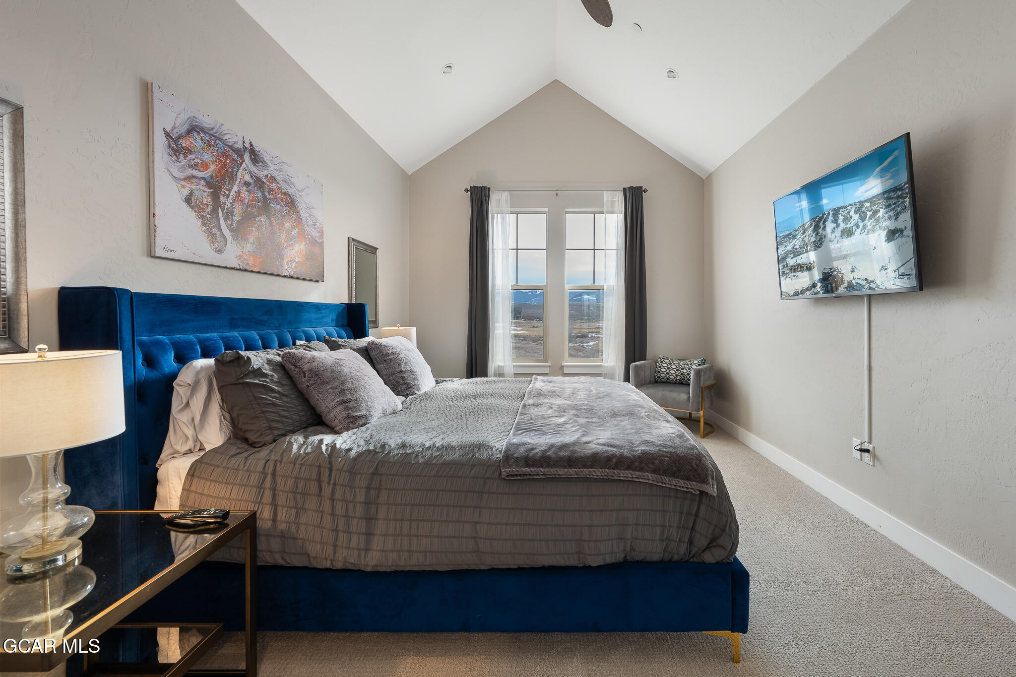 74 Eagle Ridge Drive Granby, CO 80446 - Photo 20 of 44 a bedroom with a bed and a painting on the wall