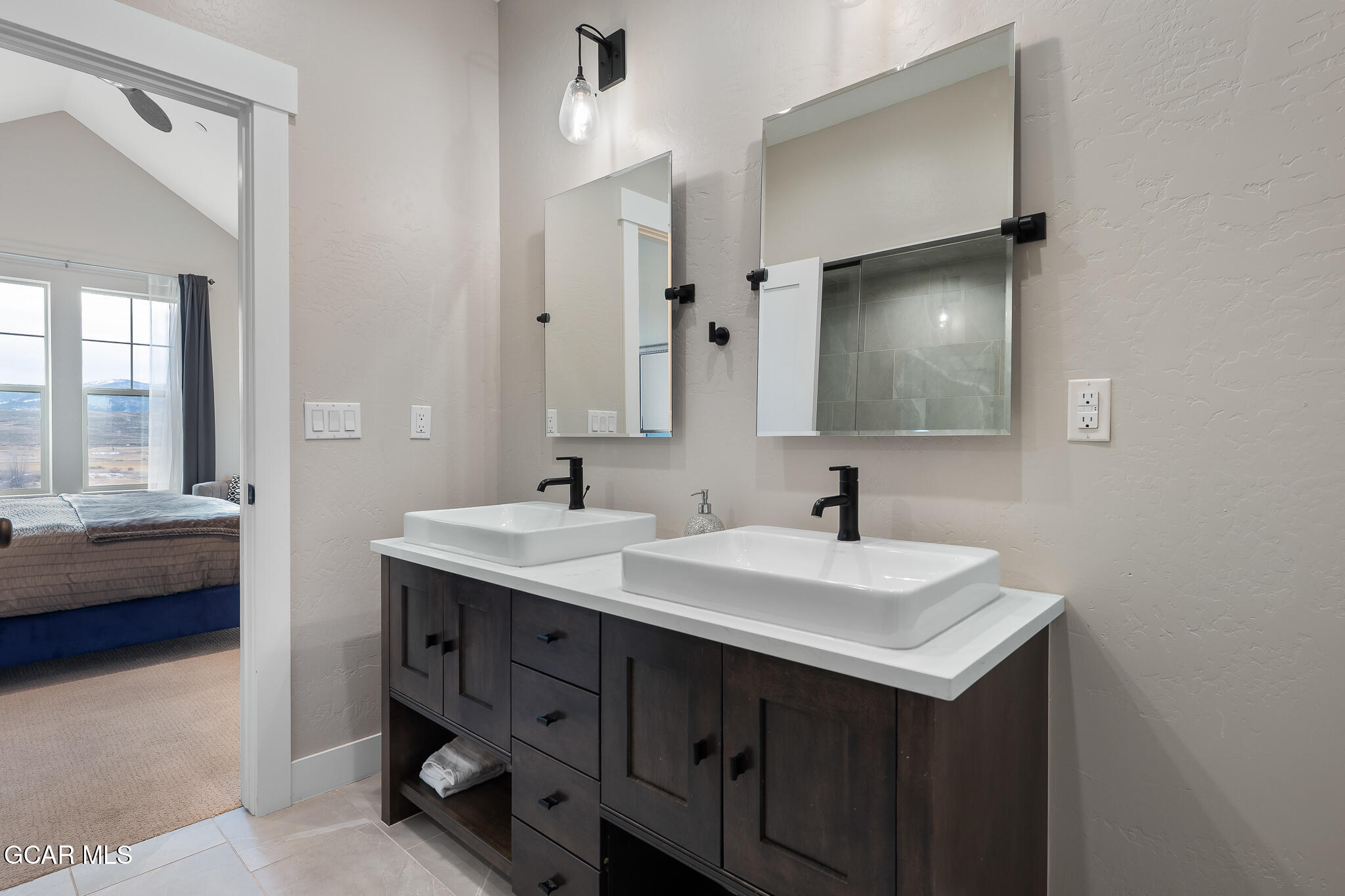 74 Eagle Ridge Drive Granby, CO 80446 - Photo 21 of 44 a bathroom with a sink and a mirror