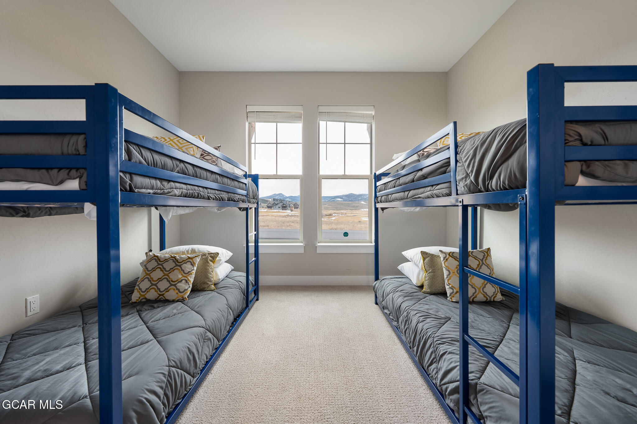 74 Eagle Ridge Drive Granby, CO 80446 - Photo 26 of 44 a living room with furniture and a book shelf