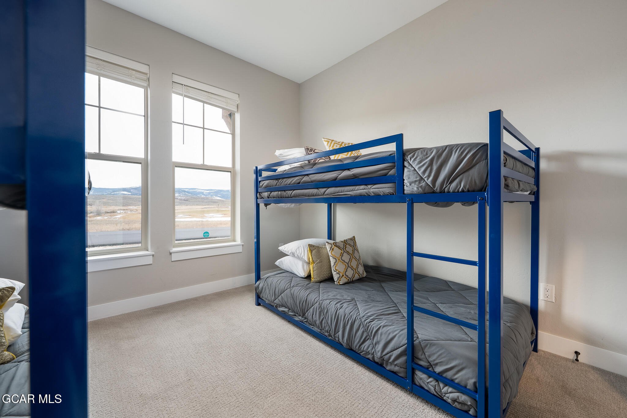 74 Eagle Ridge Drive Granby, CO 80446 - Photo 28 of 44 a bedroom with a bed and a window