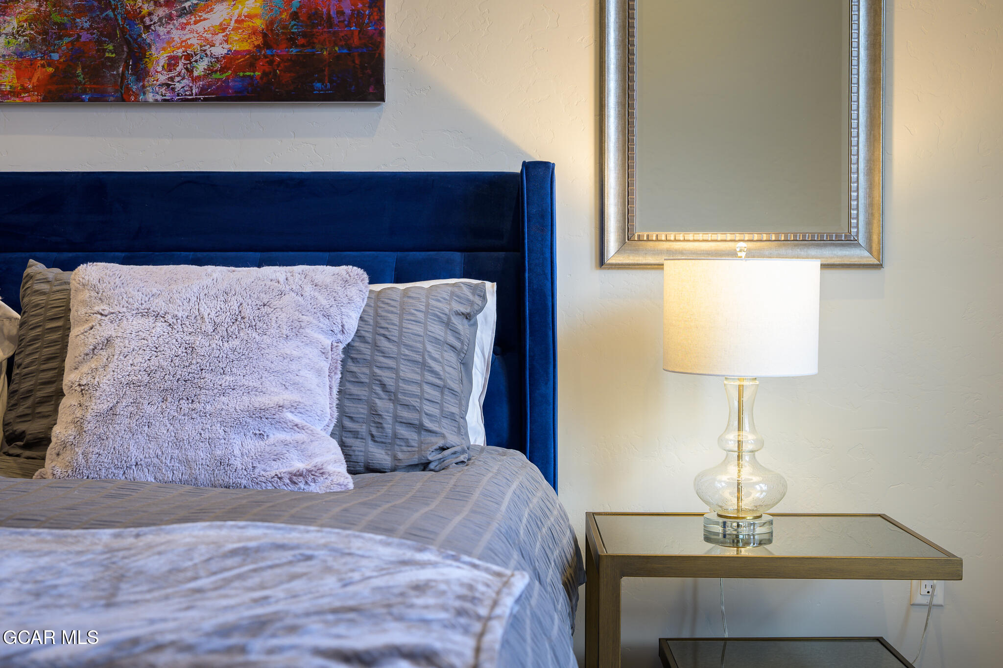 74 Eagle Ridge Drive Granby, CO 80446 - Photo 31 of 44 a bedroom with a bed and a lamp