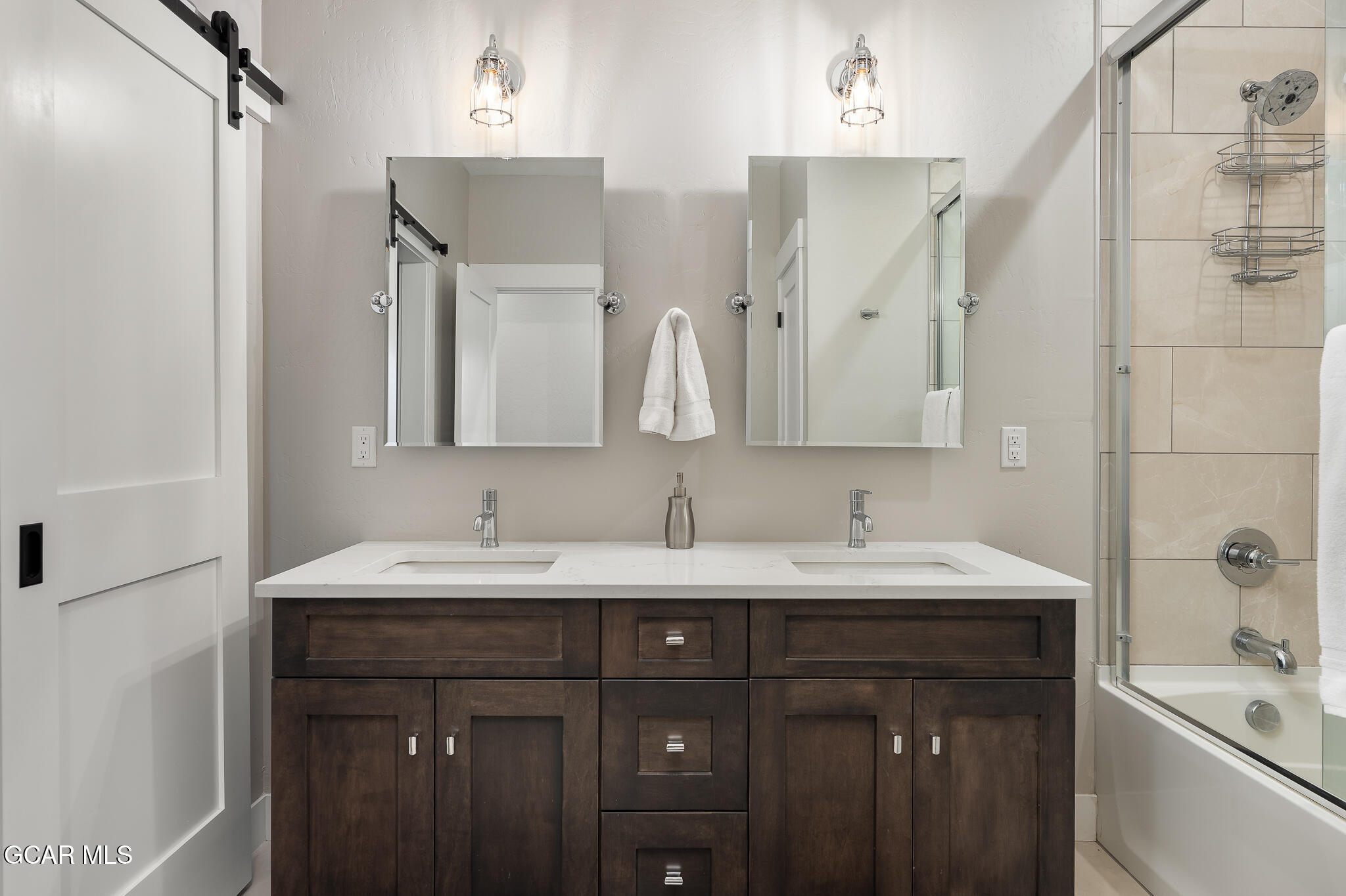 74 Eagle Ridge Drive Granby, CO 80446 - Photo 32 of 44 a bathroom with a double vanity sink mirror double and shower