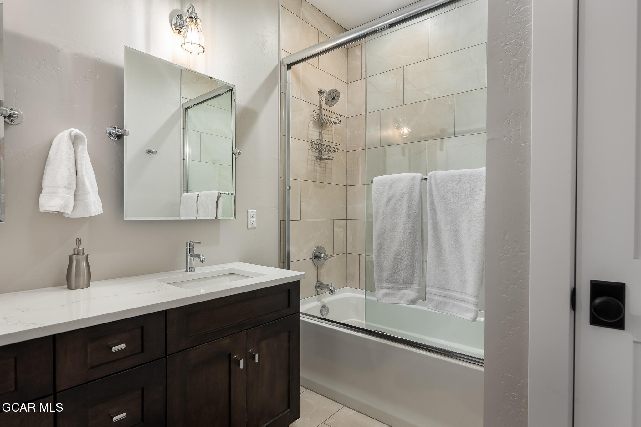 74 Eagle Ridge Drive Granby, CO 80446 - Photo 33 of 44 a bathroom with a double vanity sink mirror and shower