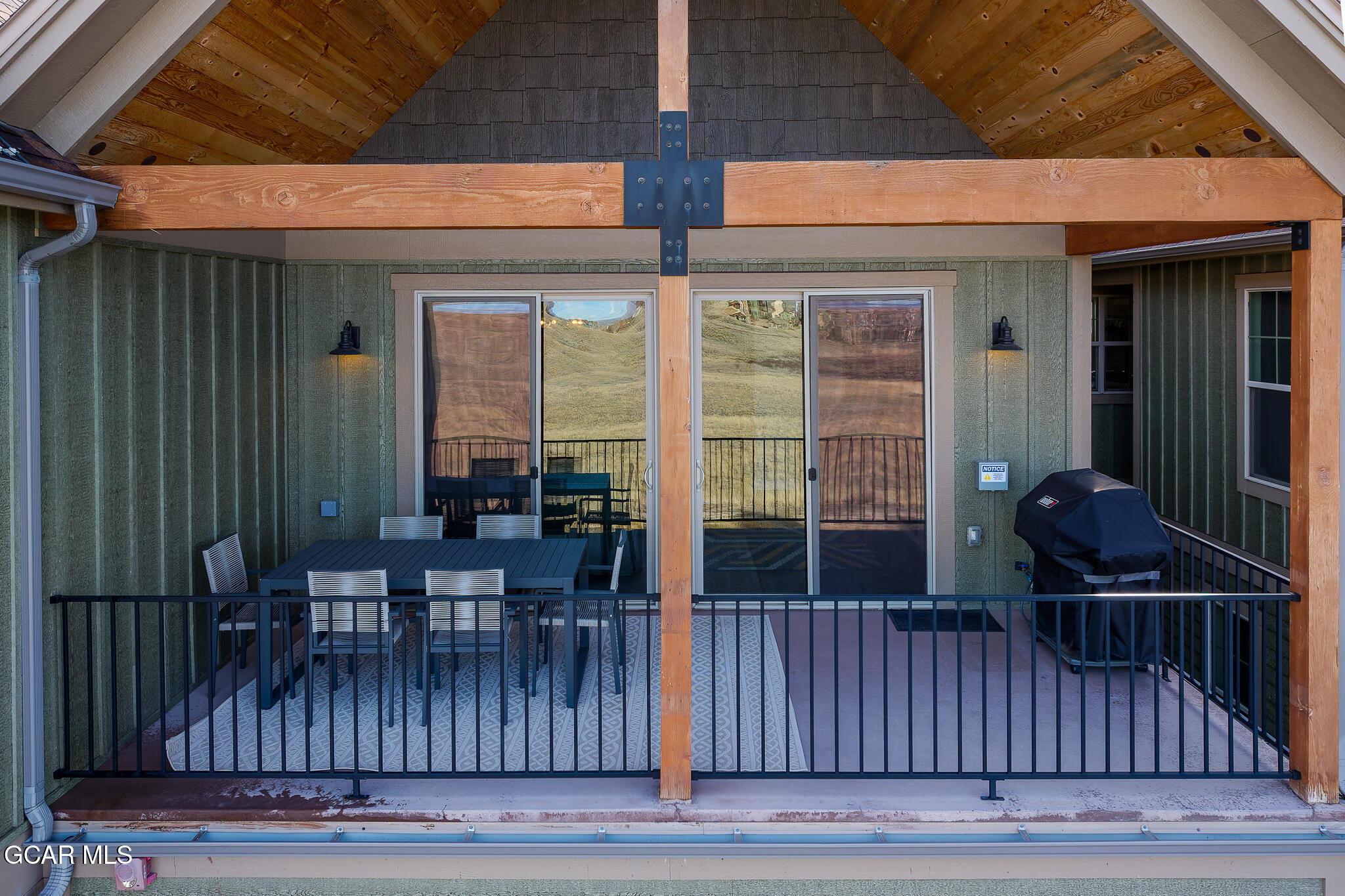 74 Eagle Ridge Drive Granby, CO 80446 - Photo 40 of 44 a view of a patio with table and chairs with wooden floor