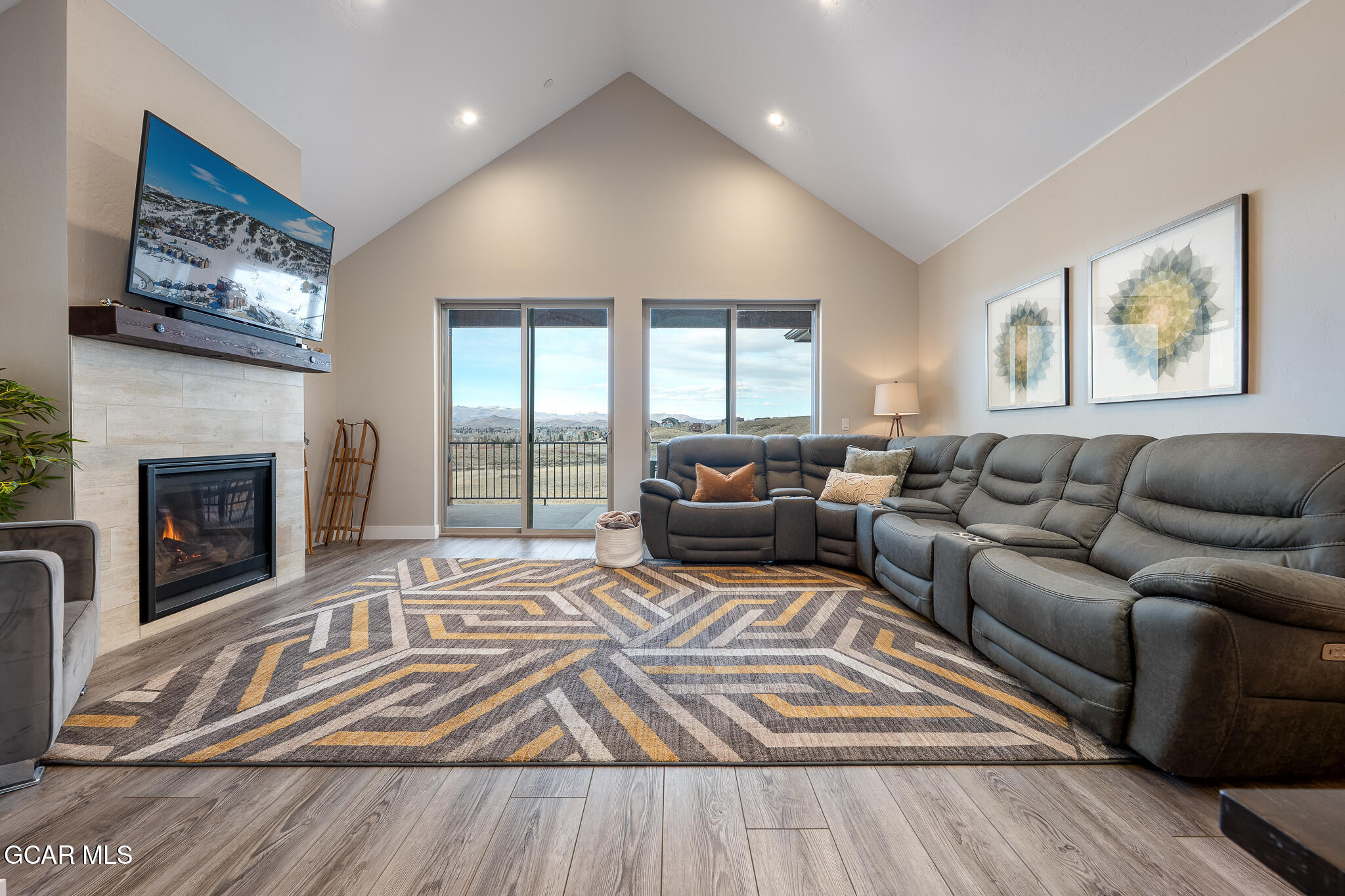 74 Eagle Ridge Drive Granby, CO 80446 - Photo 4 of 44 a living room with furniture and a fireplace