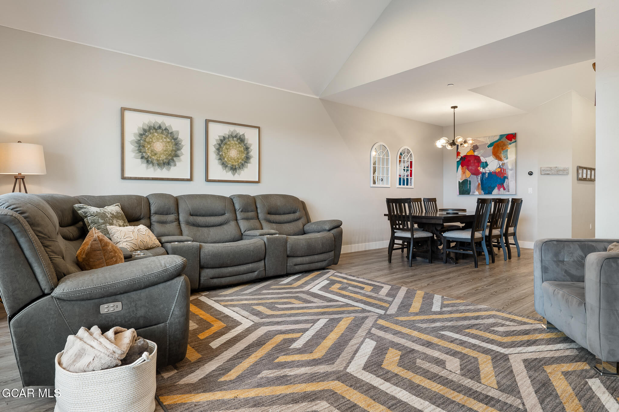 74 Eagle Ridge Drive Granby, CO 80446 - Photo 9 of 44 a living room with furniture and a dining table with wooden floor
