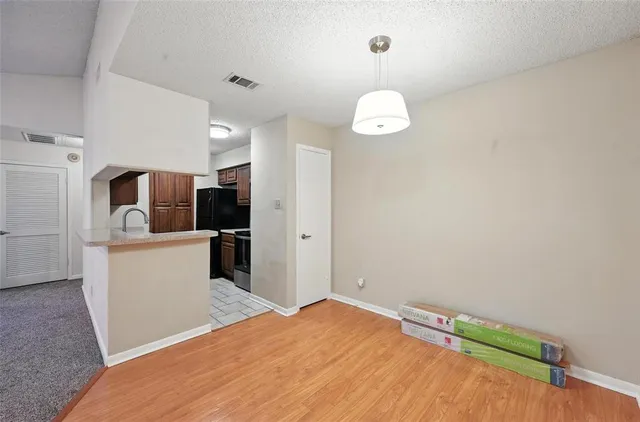 a bedroom with a bed and a television