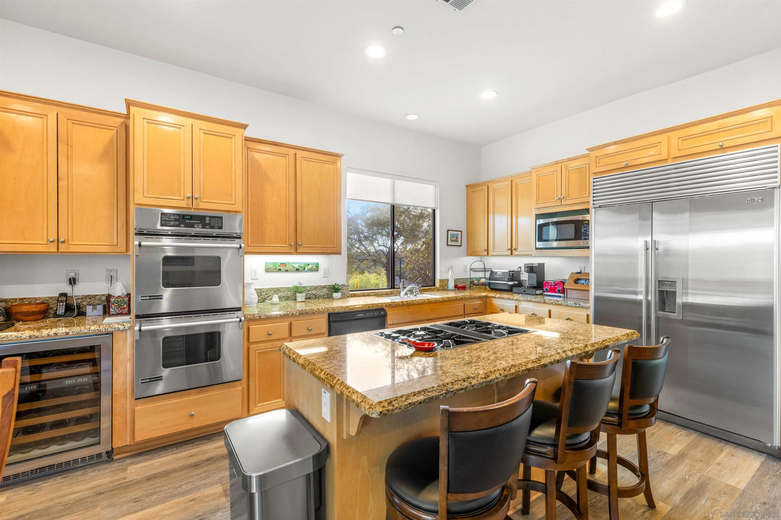 3640 Genista Place Fallbrook, CA 92028 - Photo 12 of 48 a kitchen with a stove a refrigerator and a stove top oven