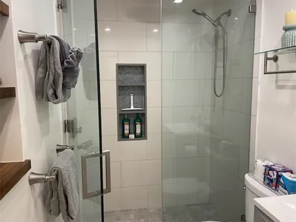 a bathroom with a bathtub and a shower