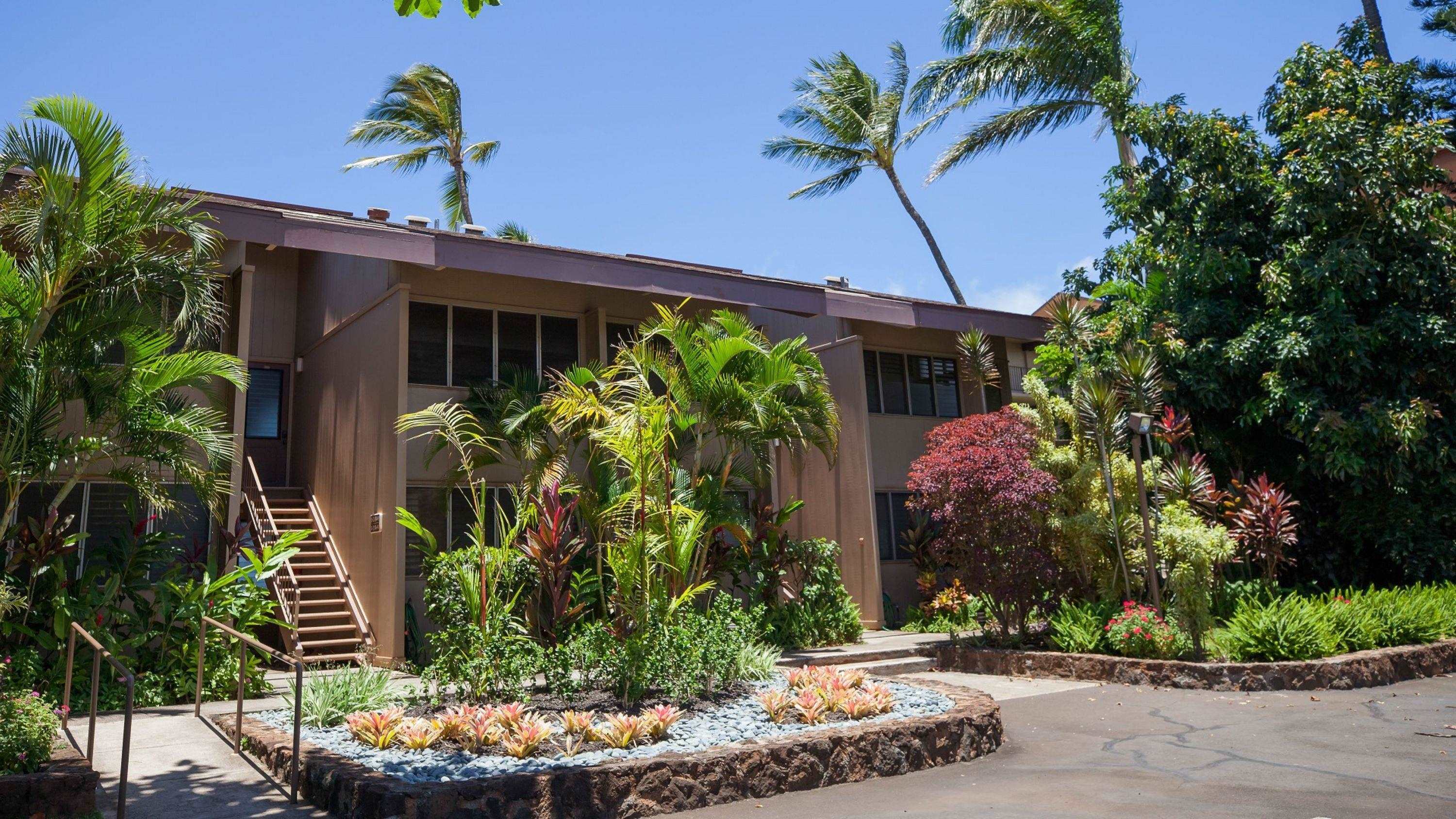 3701 Lower Honoapiilani Road, Unit 103 Lahaina, HI 96761 - Photo 21 of 29 a front view of a house with a yard