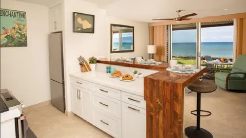 a kitchen with cabinets appliances and a sink