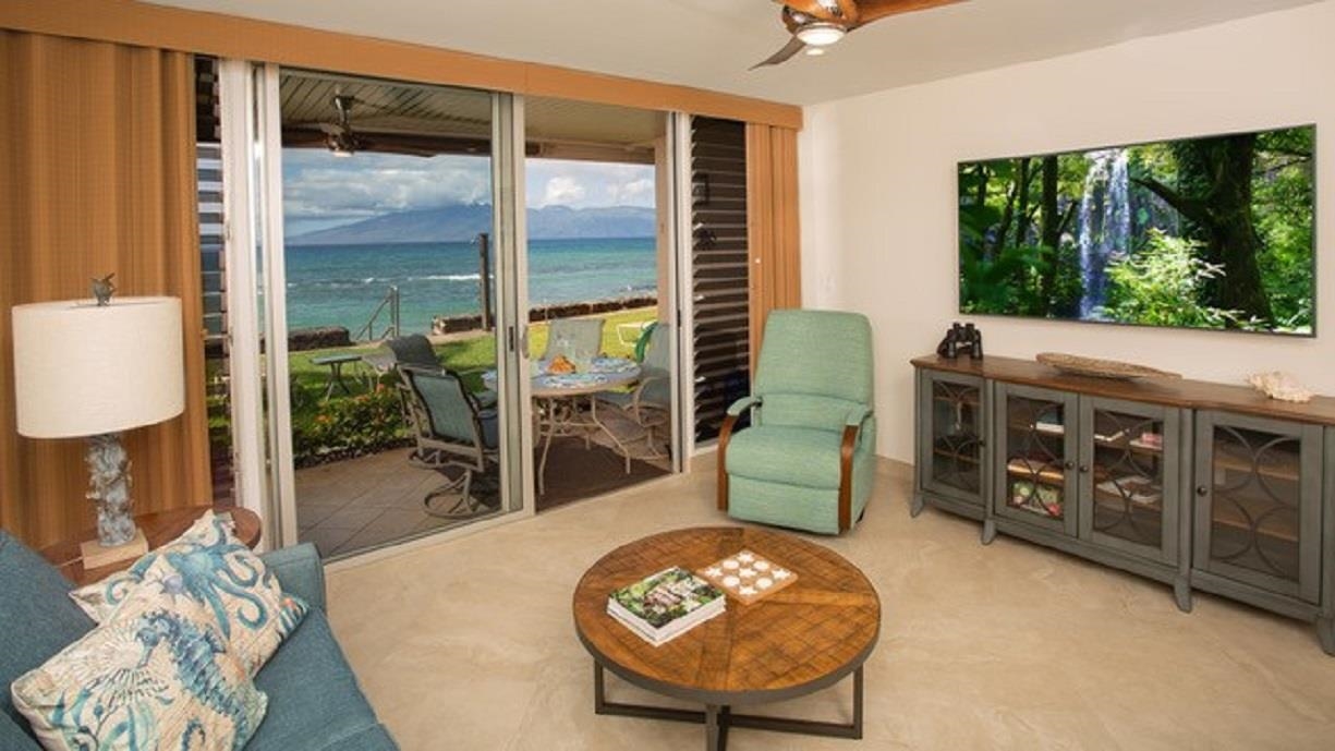3701 Lower Honoapiilani Road, Unit 103 Lahaina, HI 96761 - Photo 9 of 29 a view of a livingroom with furniture and a floor to ceiling window