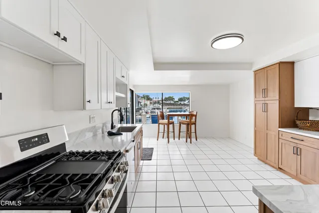 a kitchen with granite countertop a stove and a sink